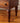 Hand-carved wave-profile legs on mid-century cabinet