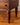 Hand-carved wave-profile legs on mid-century cabinet