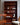 Johannes Sorth teak bookcase Denmark vintage furniture with Parker Nordic armchair