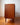 A mid-century modern wooden cabinet left hand closeup view