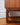 Sleigh-base detail on G-Plan Quadrille six drawer tallboy, designed in the mid-century by R. Bennet