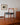 Vintage dining chairs with sculptural teak backs and black vinyl upholstery
