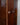 Close-up detail shot of ball knobs and original key on mid-century vintage display cabinet