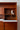 Lockable fold-down compartment on mid-century wall unit