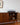 Mid-century Kolter sideboard with open cabinet displaying items, including a record player and handmade ceramics.
